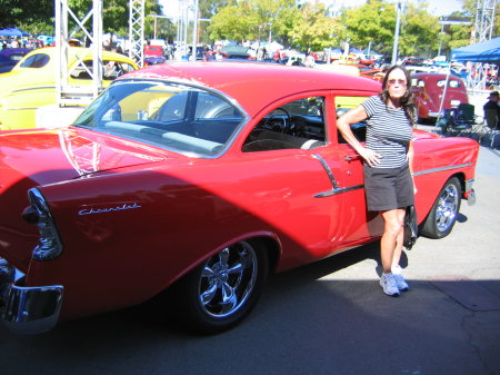 Cathy Carter posing with Gary Fong's '56 Chevy