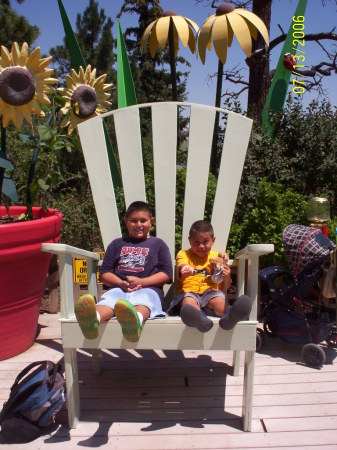 Daniel and Josh in big chair at zoo