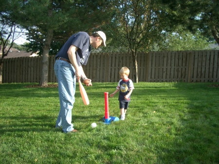 Me teaching my son Ethan the game of teeball in our back yard in Omaha