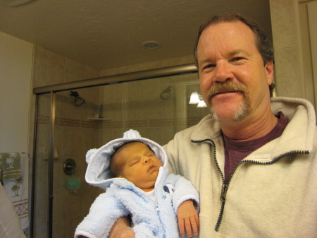 My husband Scott with our new grandson