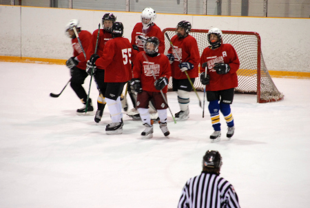 Josh and all his teamates towering over him