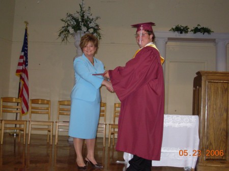 Awarding John his Diploma