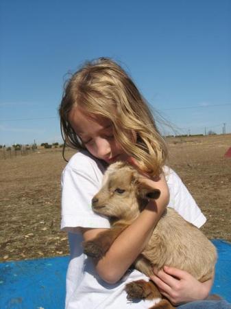 Abby with a baby goat.