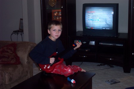 My little man playing Guitar Hero!