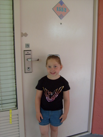 Piper standing outside of our room at Disney World