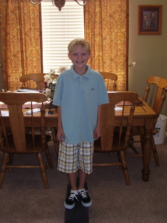 My son Riley posing on his new skateboard   June 2007