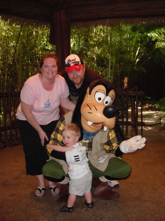 My husband, Cody and I take time to visit with Goofy.