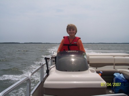 Merlin driving our boat