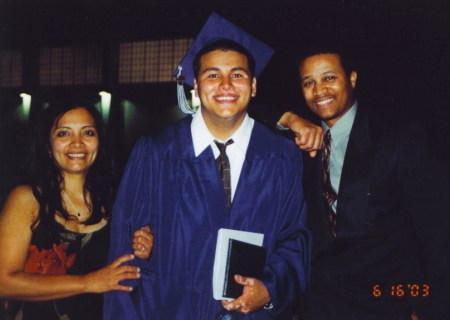My son, Joseph's highschool graduation 2003 with my husband, Dion.