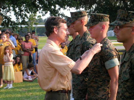 Colonel John Bratten USMC retired Pinning promotion on Bryan
