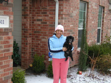 My wife, Mariana, and our Dog, Smoky, enjoying a snowy day in Texas.