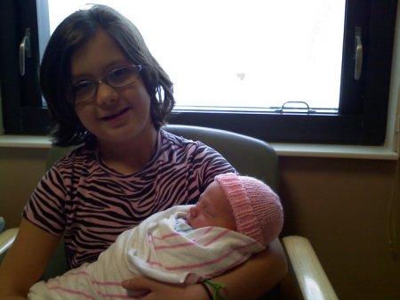 Aryana holding her lil sister Leila