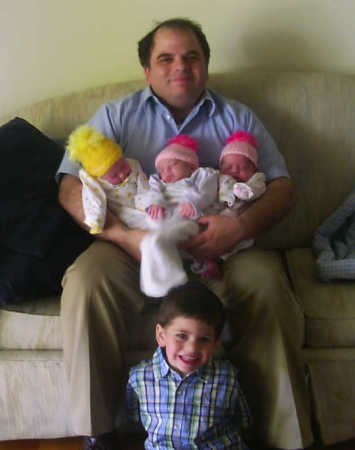 Steve with son and triplet daughters