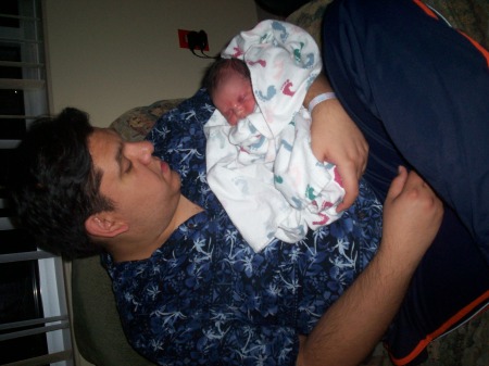 my husband with our newborn