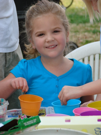 Natalie, age 5, dyeing Easter eggs.