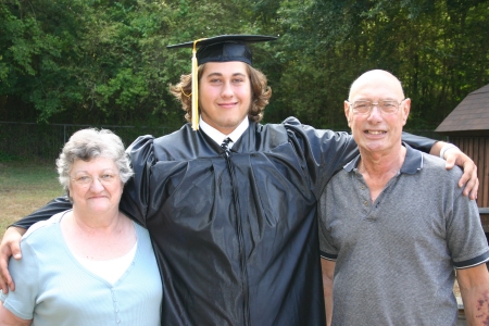 My son, Sam, with my mom and dad at high school graduation