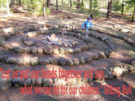 My grandson Zane on our stone spiral on our land
