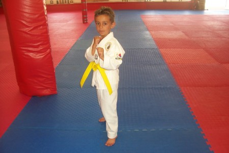 Nickolas with his yellow belt, Age 7