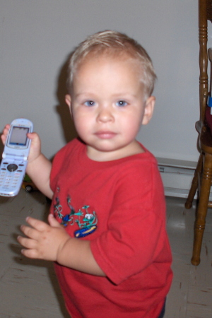 Seth with his first "real" phone.  Compliments of Aunt Jenn.