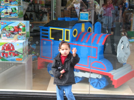 Lisa standing by Thomas the train.