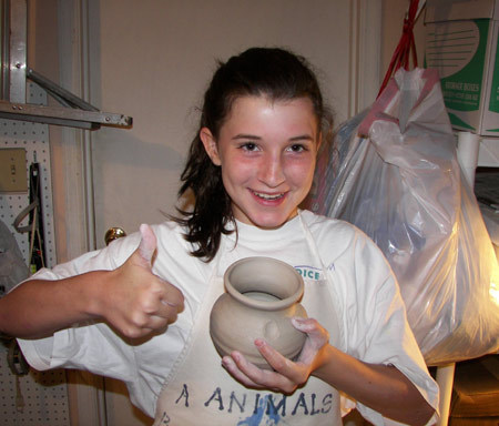 Hayley Making a Pot on the "Wheel"