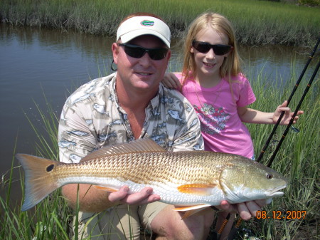 My 10 year old daughter with her first redfish!