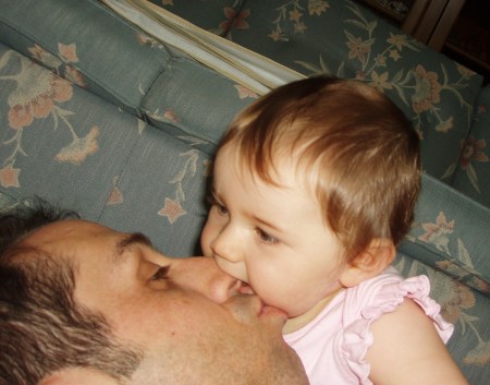 Abigail biting daddy's nose