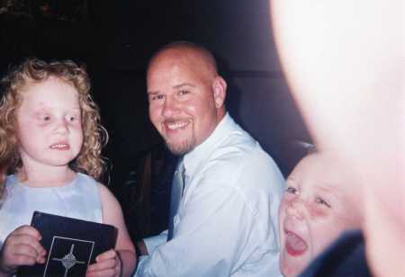 andrew , abby and daddy at a wedding