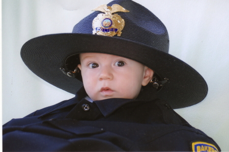 My little grandson in Daddy's uniform.  He's so precious.