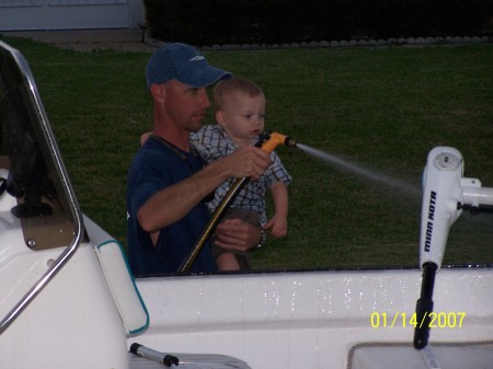 Wyatt and Daddy cleaning the boat