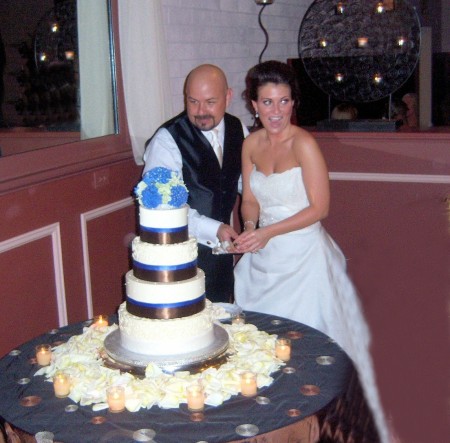 Greg and Kate cutting cake(Greg TCU class of 8