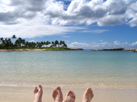 Our feet relaxing on the beach cove.
