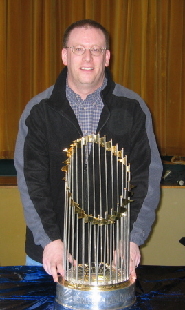 Holding the Red Sox World Series trophy