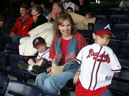 My wife Cecilia at a Braves game with two of the boys