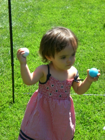 Carmela Playing With Daddy's Golf Balls