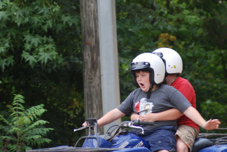 My son Terrell on the 4 wheeler with his friend