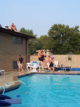 Dave jumping off our roof into our pool
