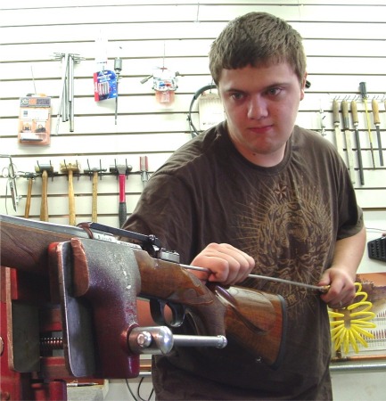 Quinton Cleaning a Rifle