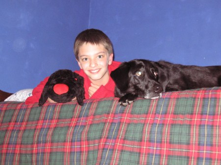 Ethan-(our oldest/middle) boy-12 years old- hanging out with our Black Lab Shadow