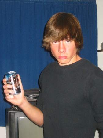 Taylor my middle son, posing with his Mt. Dew