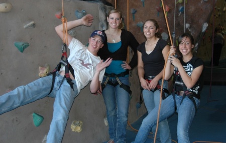 Kasey (far right) and friends rock climbing at Stone Age Gym