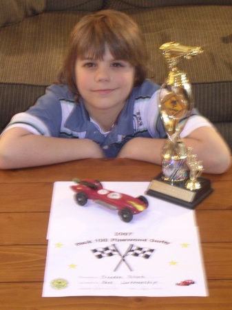 Brandon and his trophy winning Pinewood derby car