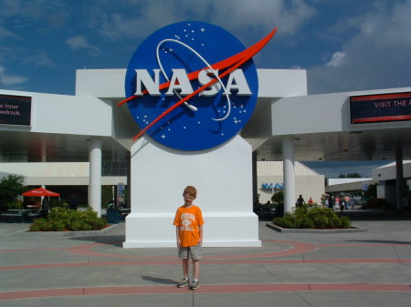 Tyler at the NASA Sign at Kennedy Space Center Florida