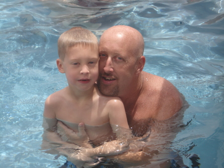 Richie and Travis in our backyard pool