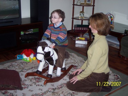 Adam on Jillian's horse while mom looks on