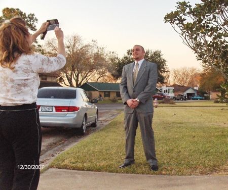 Mom taking a picture, and me taking a picture, Our son soaking up the attention