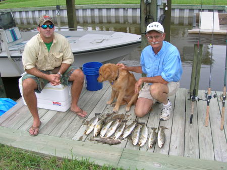 James, his dog Foster and some speckled trout