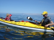 Mike, Morgan kayaking with whale