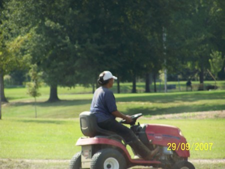 Terri cutting Grass