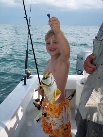 Youngest son catching a color coordinated fish - Keys 2007